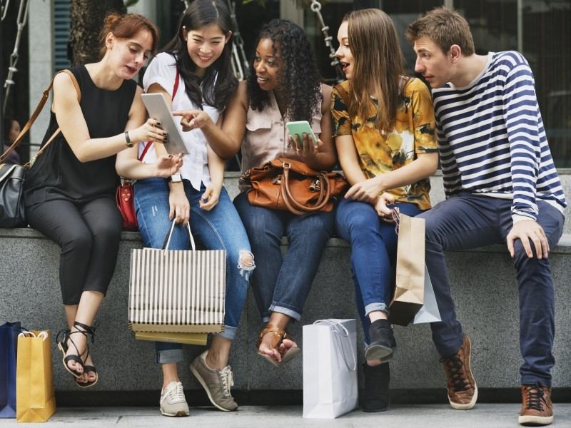 Group of friends doing shopping from retail store 