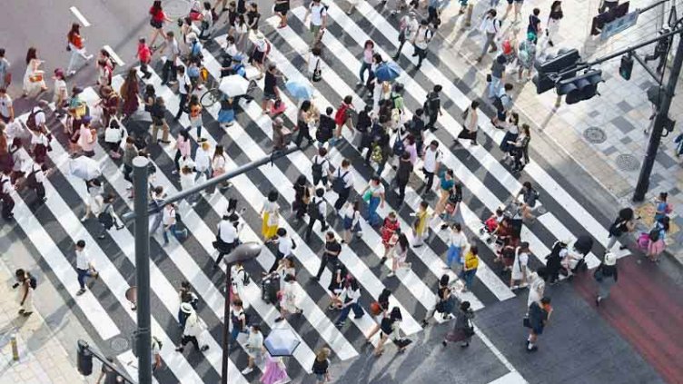 People passing on pedestrian lane at daytime