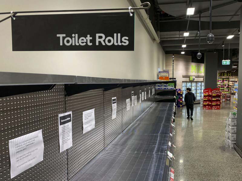 A man looking for household staples to buy in a shopping mall