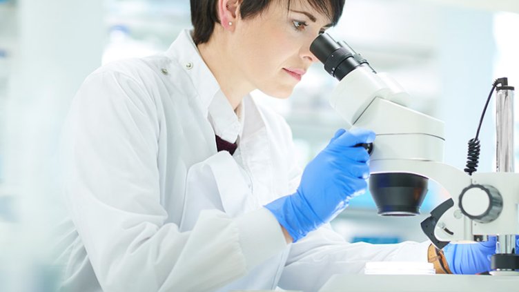 A girl using a microscope