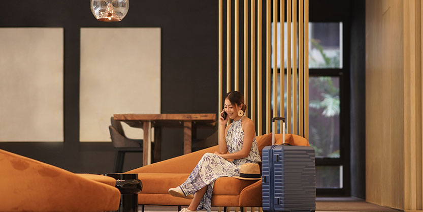 Women with mobile at living room