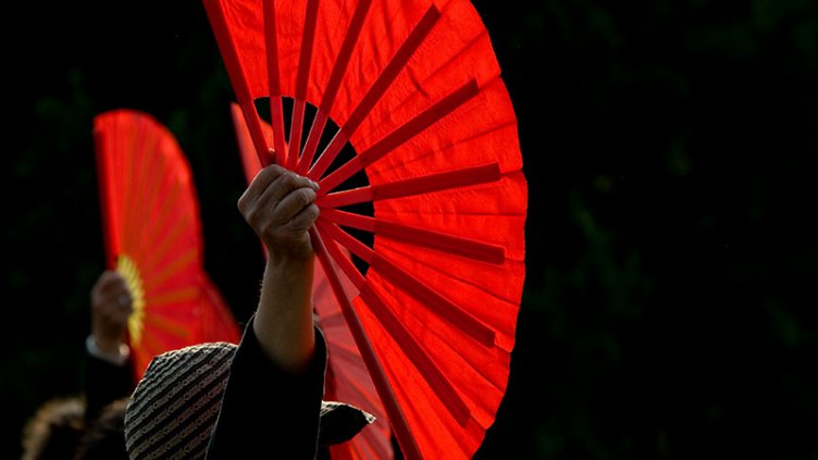 women with hand fan