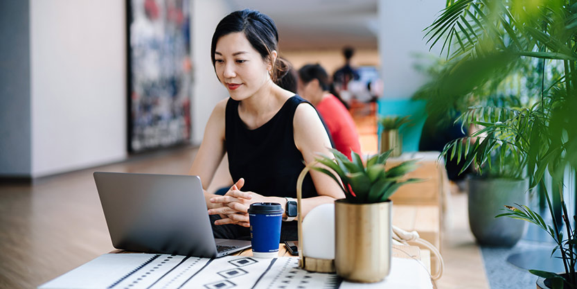 Lady working on laptop in office