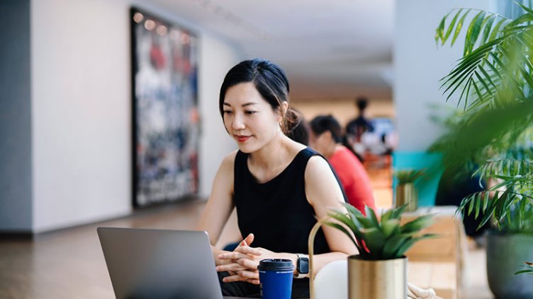 Lady working on laptop in office