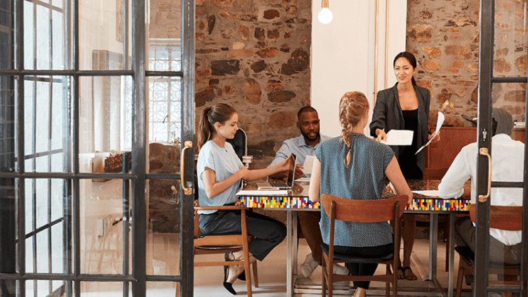 employee discussing about business in meeting room