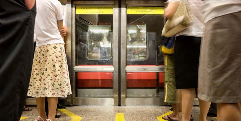 people waiting for train at platform