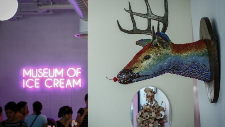 People gathered and having icecream inside museum of icecream