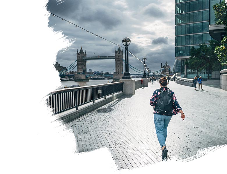 A women walking across a bridge