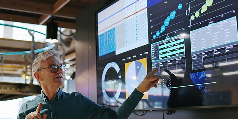 A man explaining something using screen