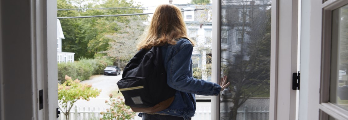 A girl standing near the door