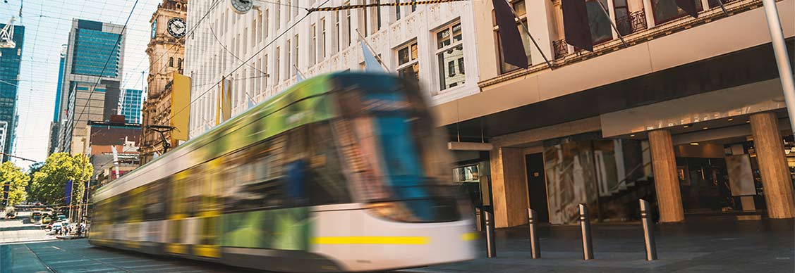 Bourke St Mall with tram passing through frame.