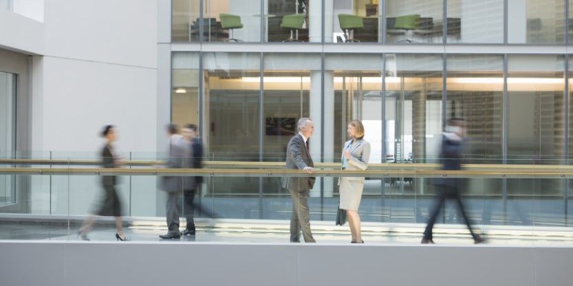 Two investors discussing something in the office