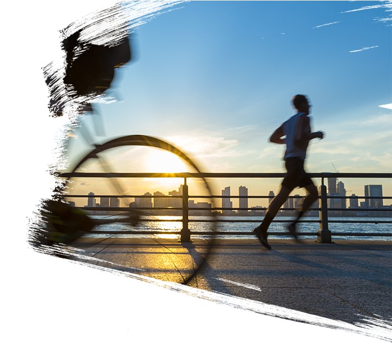 A man running early morning near a river