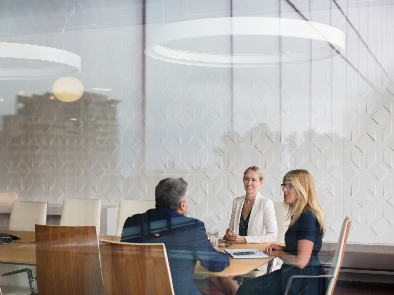 Group of investors discussing inside the meeting room