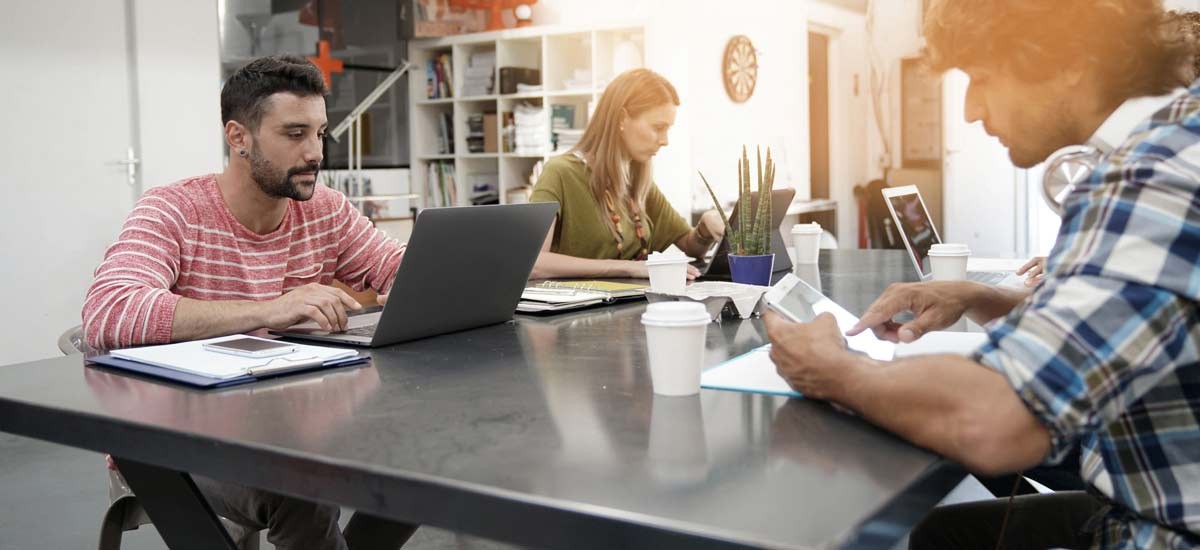 3 employees working in a coworking space