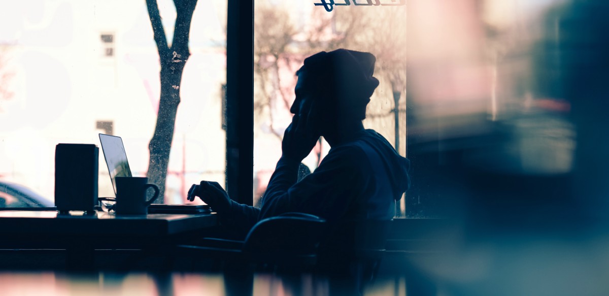 man on phone in a café